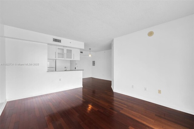 275 NE 18th St Unit 706, Miami, FL 33132 - unfurnished living room with dark wood-style flooring and electric panel