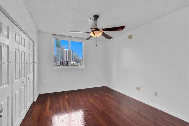 275 NE 18th St Unit 706, Miami, FL 33132 - unfurnished bedroom featuring hardwood / wood-style flooring, a closet, and a ceiling fan