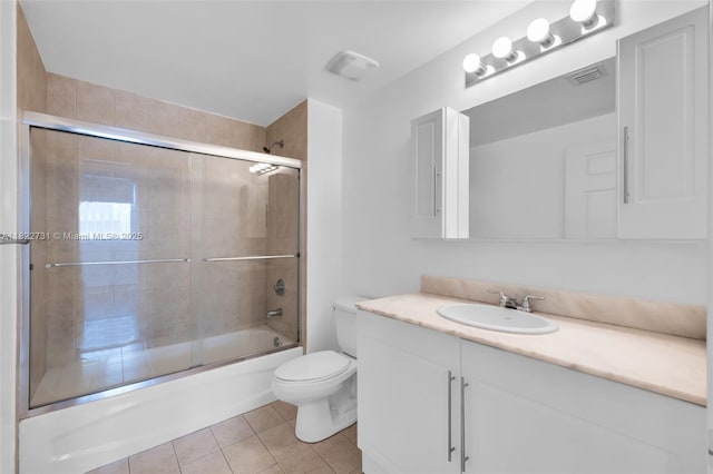 275 NE 18th St Unit 706, Miami, FL 33132 - bathroom featuring vanity, tile patterned floors, and bath / shower combo with glass door