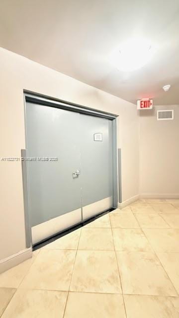 275 NE 18th St Unit 706, Miami, FL 33132 - spare room featuring light tile patterned floors and baseboards