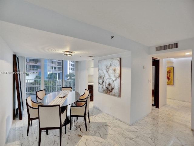 1627 Brickell Ave Unit 605, Miami, FL 33129 - dining space with light marble finish floors