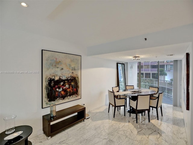 1627 Brickell Ave Unit 605, Miami, FL 33129 - dining room featuring marble tiled flooring