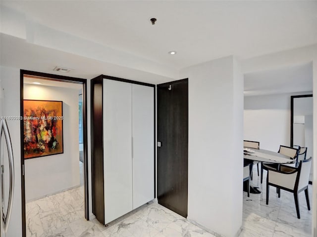 1627 Brickell Ave Unit 605, Miami, FL 33129 - bedroom with light marble finish flooring, a closet, and recessed lighting