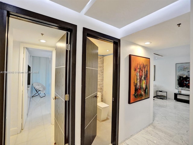 1627 Brickell Ave Unit 605, Miami, FL 33129 - corridor with light marble finish flooring and recessed lighting