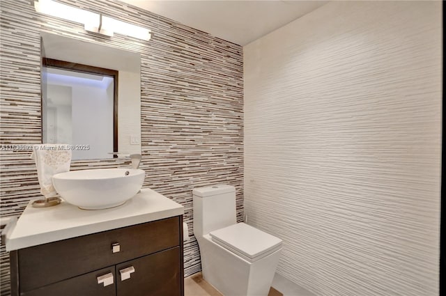1627 Brickell Ave Unit 605, Miami, FL 33129 - bathroom featuring vanity and tile walls