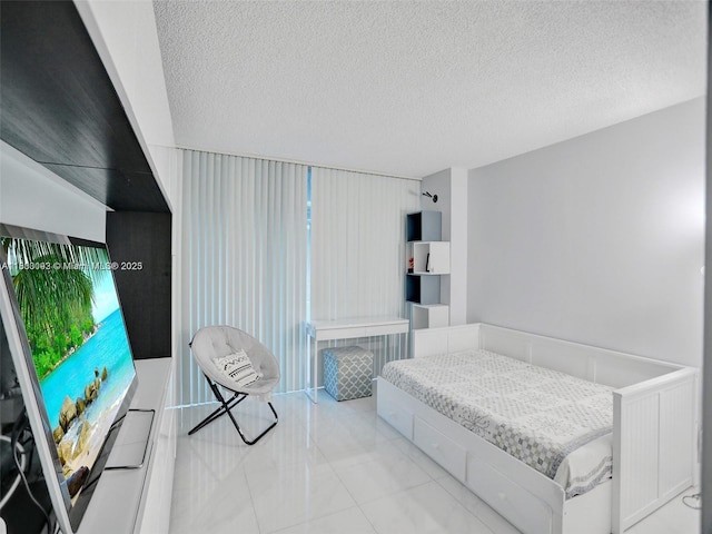 1627 Brickell Ave Unit 605, Miami, FL 33129 - tiled bedroom with a textured ceiling
