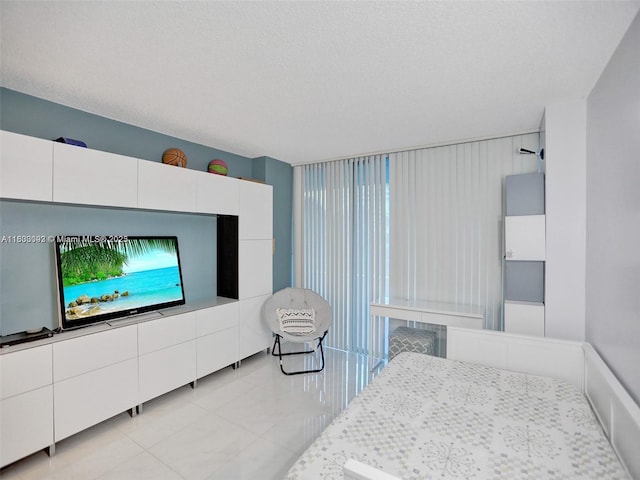 1627 Brickell Ave Unit 605, Miami, FL 33129 - bedroom featuring light tile patterned floors