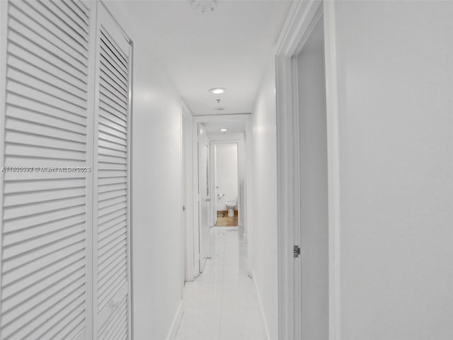 1627 Brickell Ave Unit 605, Miami, FL 33129 - hallway featuring light tile patterned floors and recessed lighting