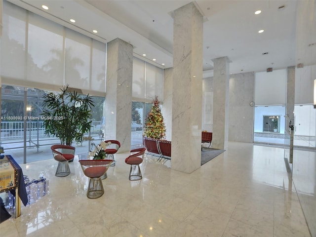 1627 Brickell Ave Unit 605, Miami, FL 33129 - lobby with a high ceiling, recessed lighting, and floor to ceiling windows