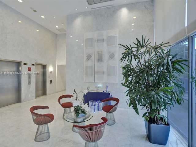 1627 Brickell Ave Unit 605, Miami, FL 33129 - building lobby with recessed lighting and a towering ceiling