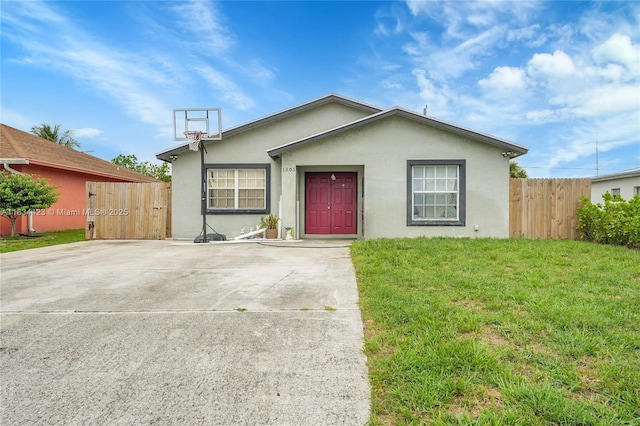 1303 W 6th St, Riviera Beach, FL 33404 - view of front of property featuring stucco siding and concrete driveway