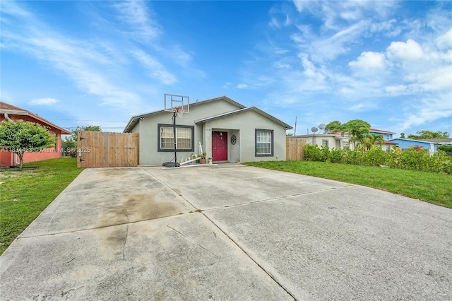 1303 W 6th St, Riviera Beach, FL 33404 - ranch-style house with stucco siding and driveway