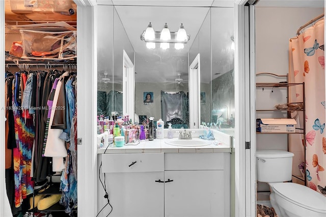 1303 W 6th St, Riviera Beach, FL 33404 - full bathroom with vanity, a spacious closet, and ceiling fan
