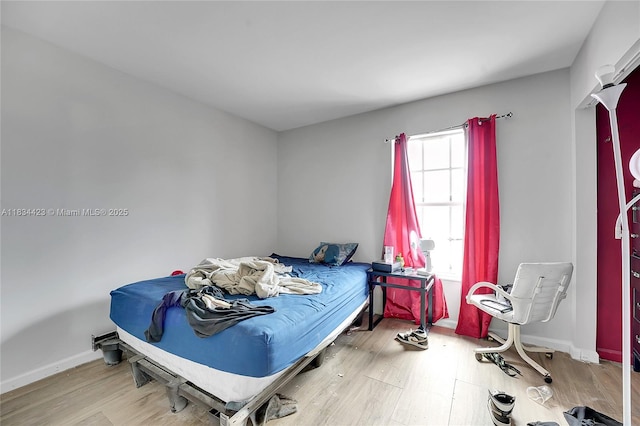 1303 W 6th St, Riviera Beach, FL 33404 - bedroom with wood finished floors and baseboards