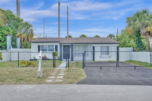 1610 S 29th Ave, Hollywood, FL 33020 - ranch-style house featuring a gate, a fenced front yard, and stucco siding