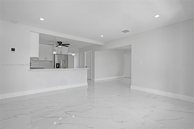 1610 S 29th Ave, Hollywood, FL 33020 - unfurnished living room with light marble finish flooring, ceiling fan, and recessed lighting