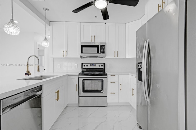 1610 S 29th Ave, Hollywood, FL 33020 - kitchen featuring stainless steel appliances, a ceiling fan, light countertops, and white cabinets