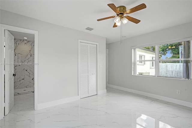 1610 S 29th Ave, Hollywood, FL 33020 - unfurnished bedroom with light marble finish flooring, a closet, ensuite bathroom, and ceiling fan