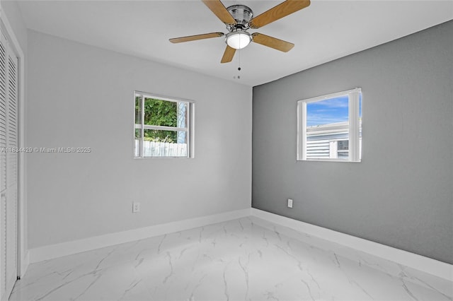 1610 S 29th Ave, Hollywood, FL 33020 - unfurnished bedroom featuring marble finish flooring, a closet, and a ceiling fan