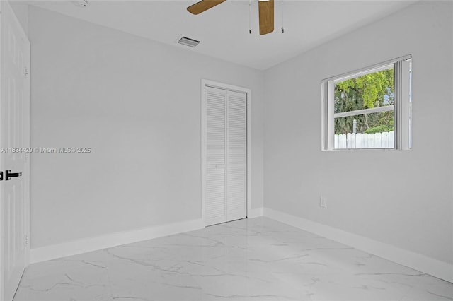 1610 S 29th Ave, Hollywood, FL 33020 - unfurnished bedroom featuring marble finish flooring, a closet, and ceiling fan