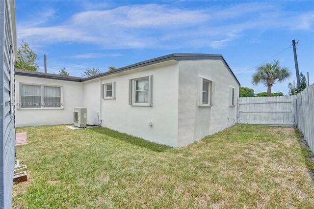 1610 S 29th Ave, Hollywood, FL 33020 - back of property featuring stucco siding and a fenced backyard