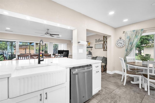 5820 Australian Pine Dr, Tamarac, FL 33319 - kitchen with stainless steel dishwasher, recessed lighting, ceiling fan, white cabinets, and light stone counters