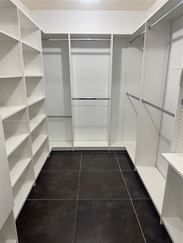 5820 Australian Pine Dr, Tamarac, FL 33319 - walk in closet with dark tile patterned flooring