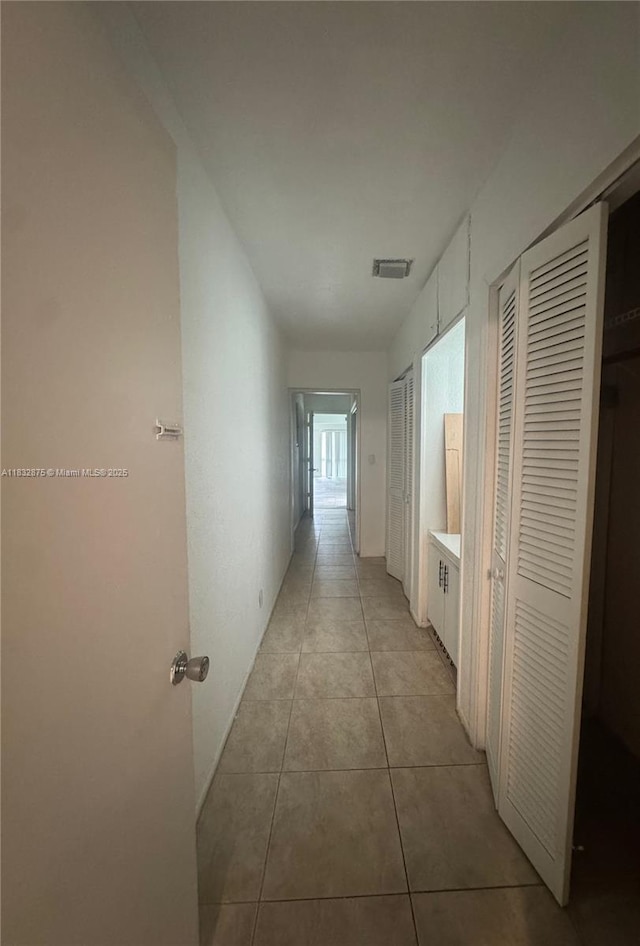 5820 Australian Pine Dr, Tamarac, FL 33319 - hallway with light tile patterned flooring