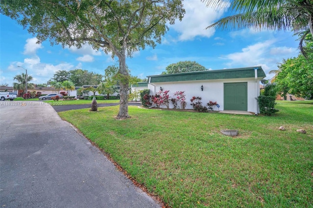 5820 Australian Pine Dr, Tamarac, FL 33319 - view of front of home with a front lawn and stucco siding