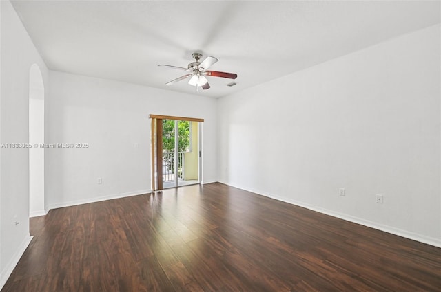 2456 SE 19th Ct, Homestead, FL 33035 - unfurnished room with a ceiling fan, dark wood-style floors, and arched walkways