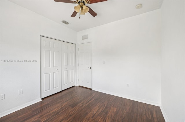 2456 SE 19th Ct, Homestead, FL 33035 - unfurnished bedroom featuring dark wood-style flooring, a closet, and a ceiling fan