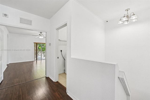 2456 SE 19th Ct, Homestead, FL 33035 - hallway featuring hardwood / wood-style floors and a chandelier
