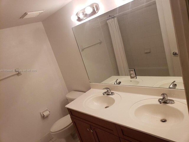 36 NW 6th Ave Unit 906, Miami, FL 33128 - full bathroom featuring double vanity and a shower with shower curtain