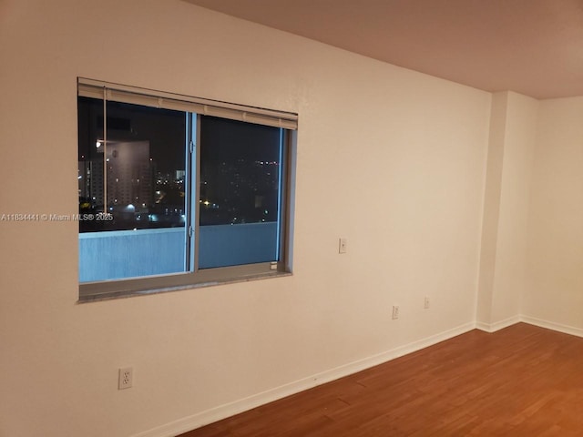 36 NW 6th Ave Unit 906, Miami, FL 33128 - spare room with wood finished floors