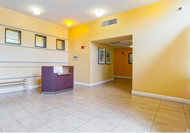 36 NW 6th Ave Unit 906, Miami, FL 33128 - spare room featuring light tile patterned floors and baseboards