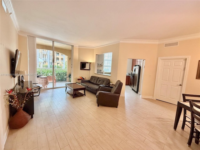3001 NE 185th St Unit 112, Aventura, FL 33180 - living area with ornamental molding and light wood-style floors