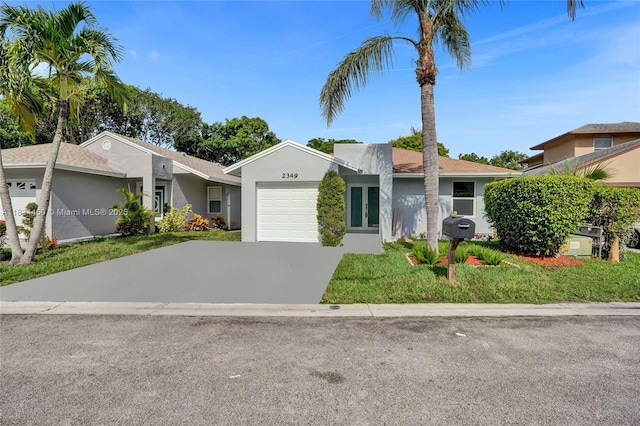 2349 NW 34th Ave, Coconut Creek, FL 33066 - view of front of house featuring driveway, an attached garage, stucco siding, french doors, and a front lawn