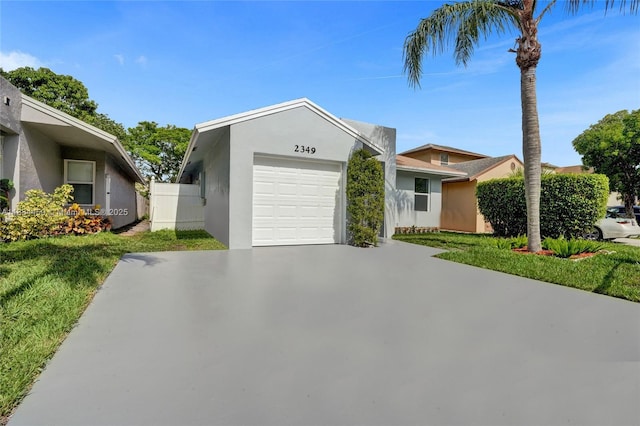 2349 NW 34th Ave, Coconut Creek, FL 33066 - view of front of home featuring a garage, stucco siding, concrete driveway, and a front lawn