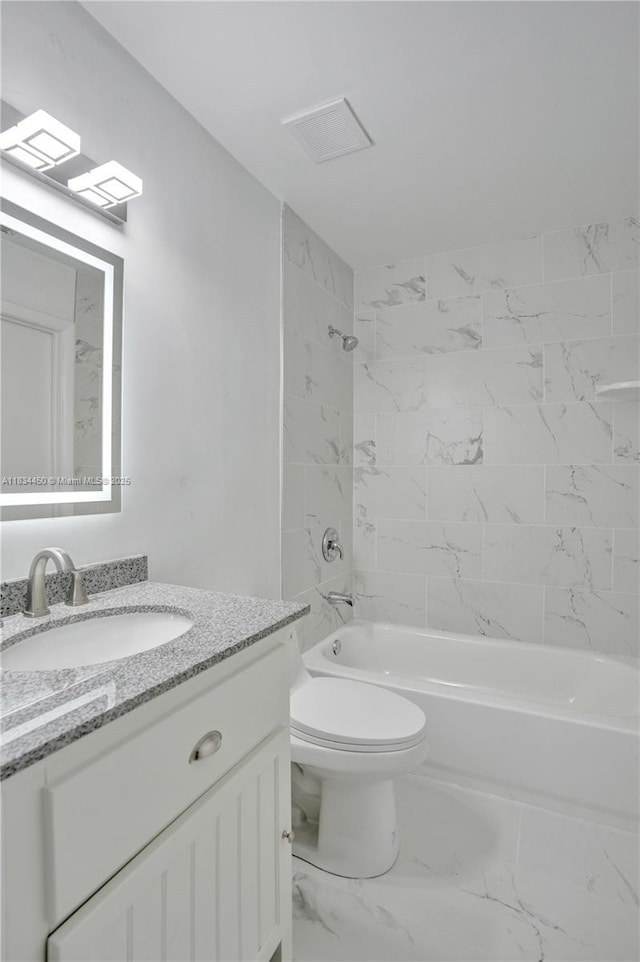 2349 NW 34th Ave, Coconut Creek, FL 33066 - bathroom featuring vanity, bathing tub / shower combination, and marble look tile flooring