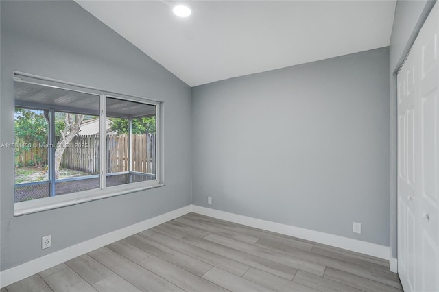 2349 NW 34th Ave, Coconut Creek, FL 33066 - unfurnished room with wood finished floors and lofted ceiling