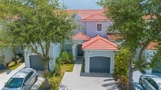 985 SW 147th Ct, Miami, FL 33194 - mediterranean / spanish home featuring a tiled roof, stucco siding, and driveway