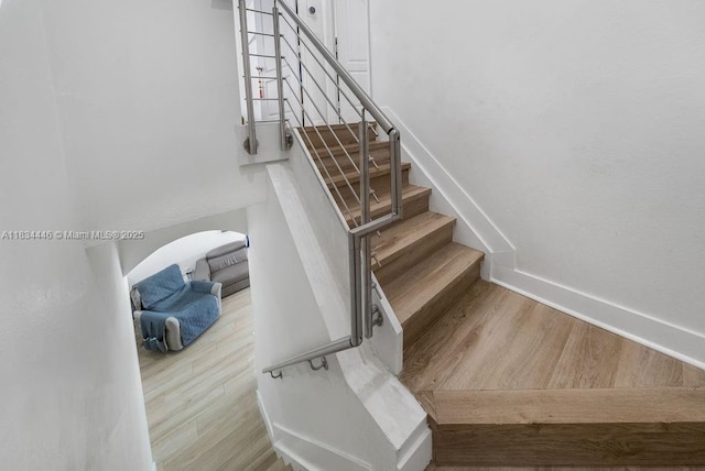 985 SW 147th Ct, Miami, FL 33194 - staircase featuring wood finished floors and baseboards