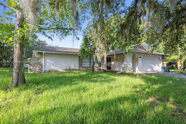 12738 Split Oak Dr, Hudson, FL 34667 - view of front facade with stucco siding, an attached garage, and driveway