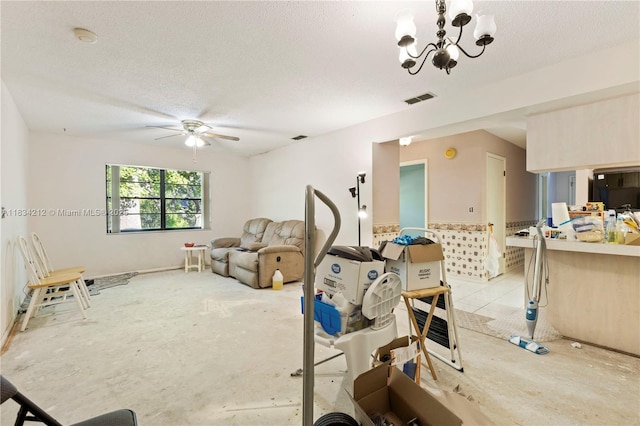 12738 Split Oak Dr, Hudson, FL 34667 - workout room featuring a textured ceiling, ceiling fan, and a chandelier