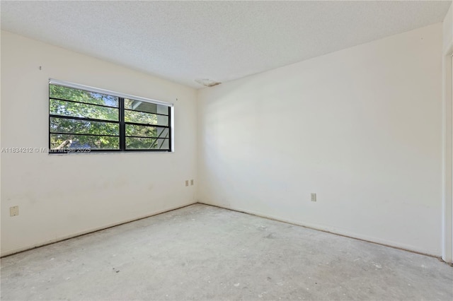 12738 Split Oak Dr, Hudson, FL 34667 - empty room with baseboards and a textured ceiling