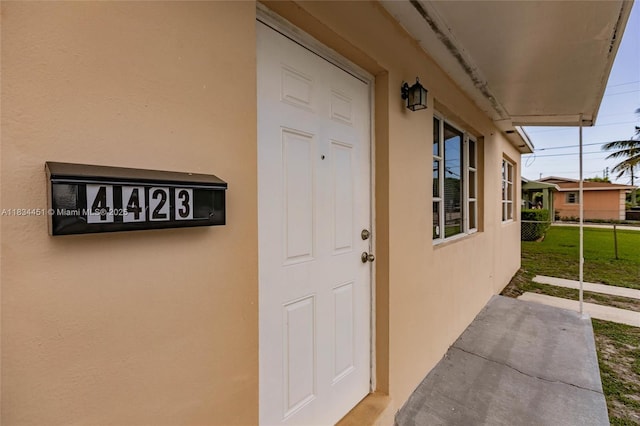 4423 Lake Ave, West Palm Beach, FL 33405 - property entrance featuring stucco siding