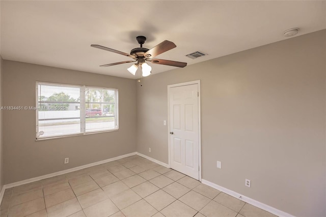 4423 Lake Ave, West Palm Beach, FL 33405 - spare room featuring a ceiling fan, light tile patterned flooring, and a smoke detector