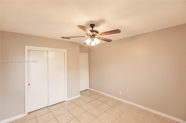 4423 Lake Ave, West Palm Beach, FL 33405 - unfurnished bedroom with a closet, ceiling fan, and light tile patterned floors