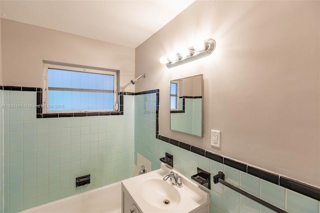 4423 Lake Ave, West Palm Beach, FL 33405 - bathroom featuring tile walls, vanity, and shower / tub combination