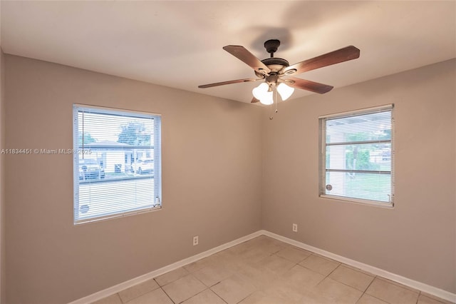 4423 Lake Ave, West Palm Beach, FL 33405 - empty room with plenty of natural light, light tile patterned floors, and a ceiling fan
